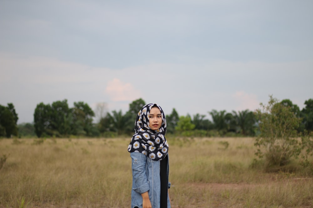 woman standing on grassfield