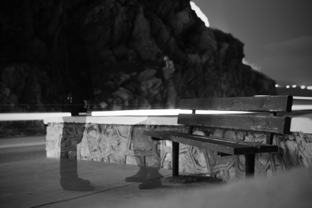 grayscale photo of empty bench