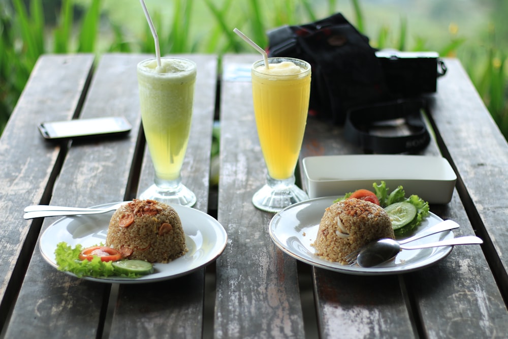 fried rice and glass of juices on table