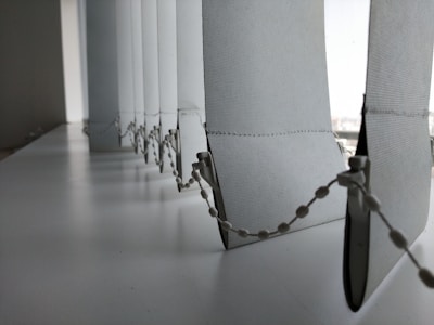 Close-up of elegant vertical blinds in a home office, showing texture and smooth operation.