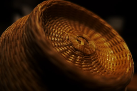 Close-up of a colorful handwoven basket with intricate patterns.