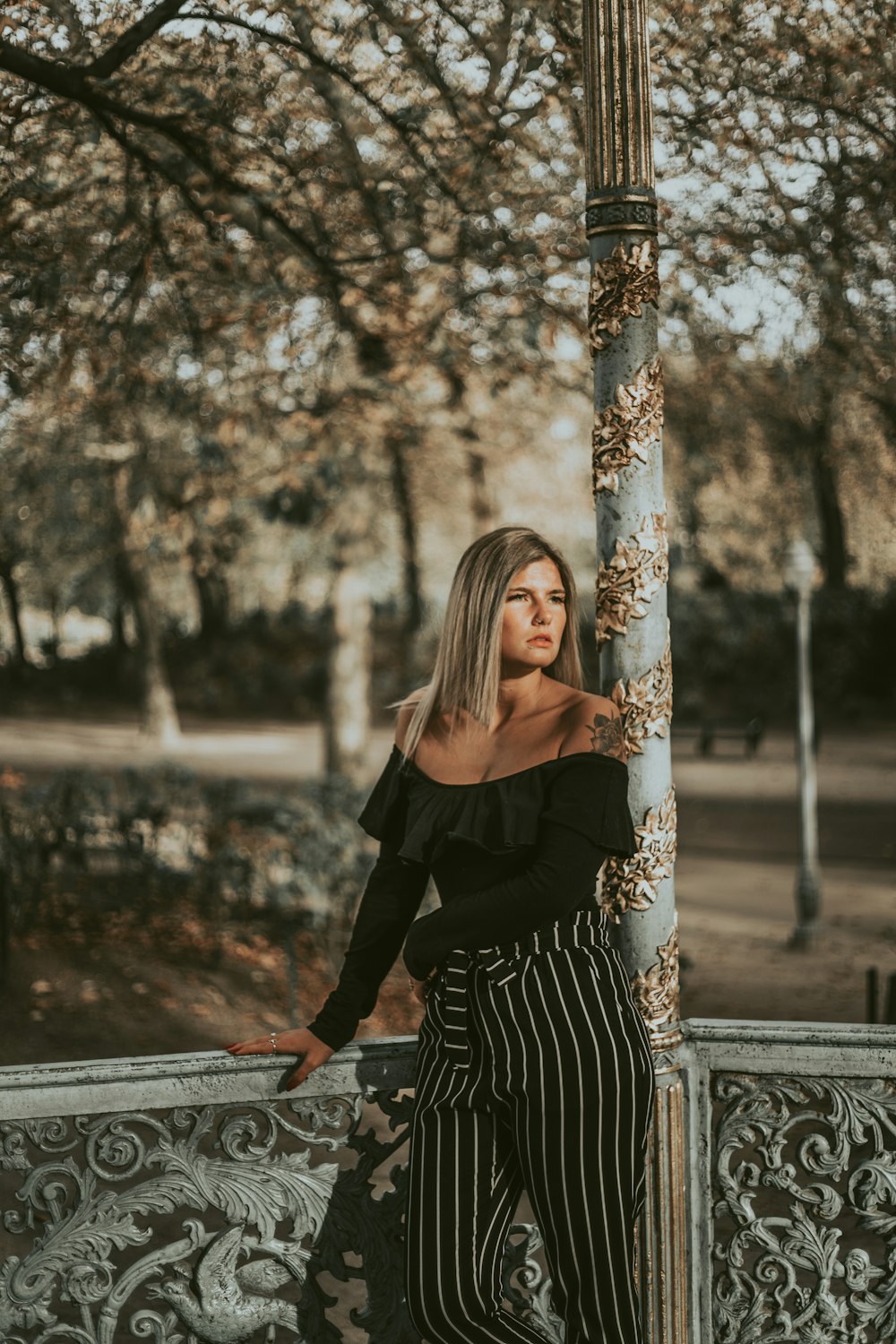 woman standing beside tree