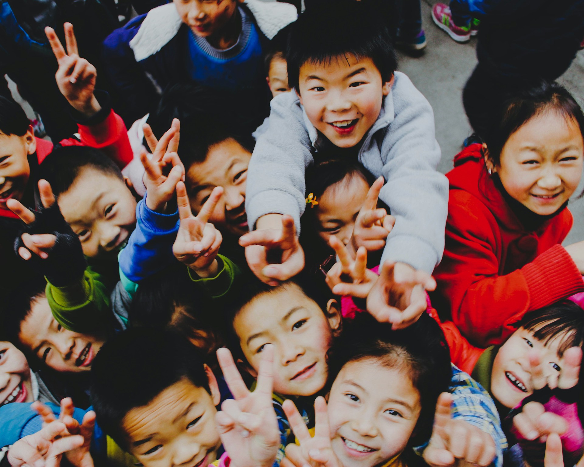 woman wearing yellow long-sleeved dress under white clouds and blue sky during daytime