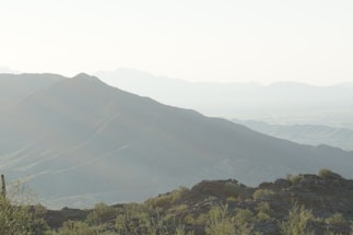 A serene view of the Arizona desert mountains at dawn, symbolizing calm and steadfastness.