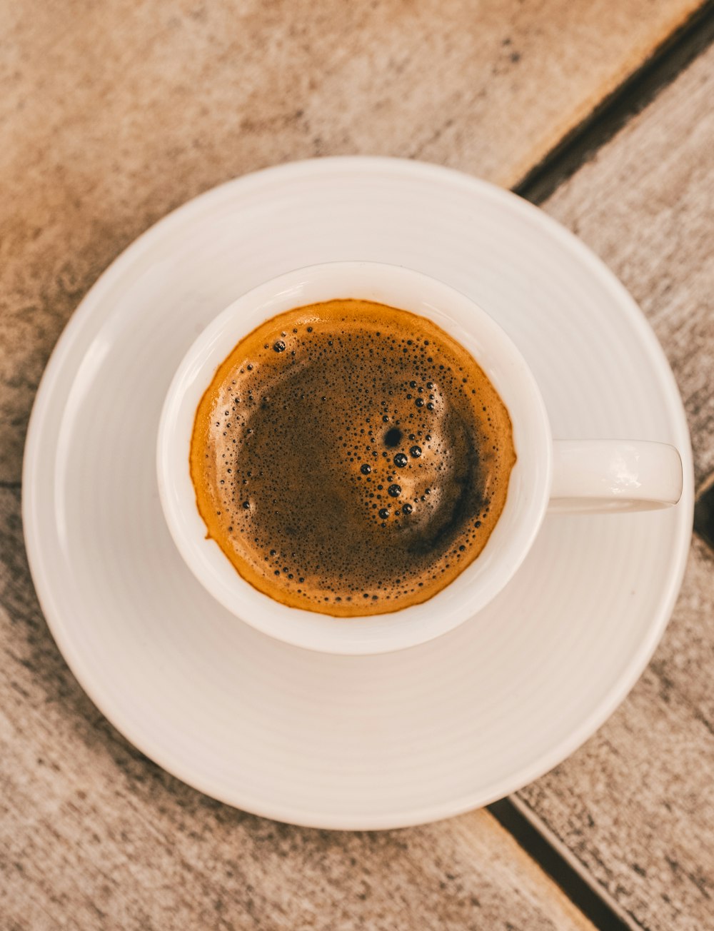 white ceramic mug on saucer