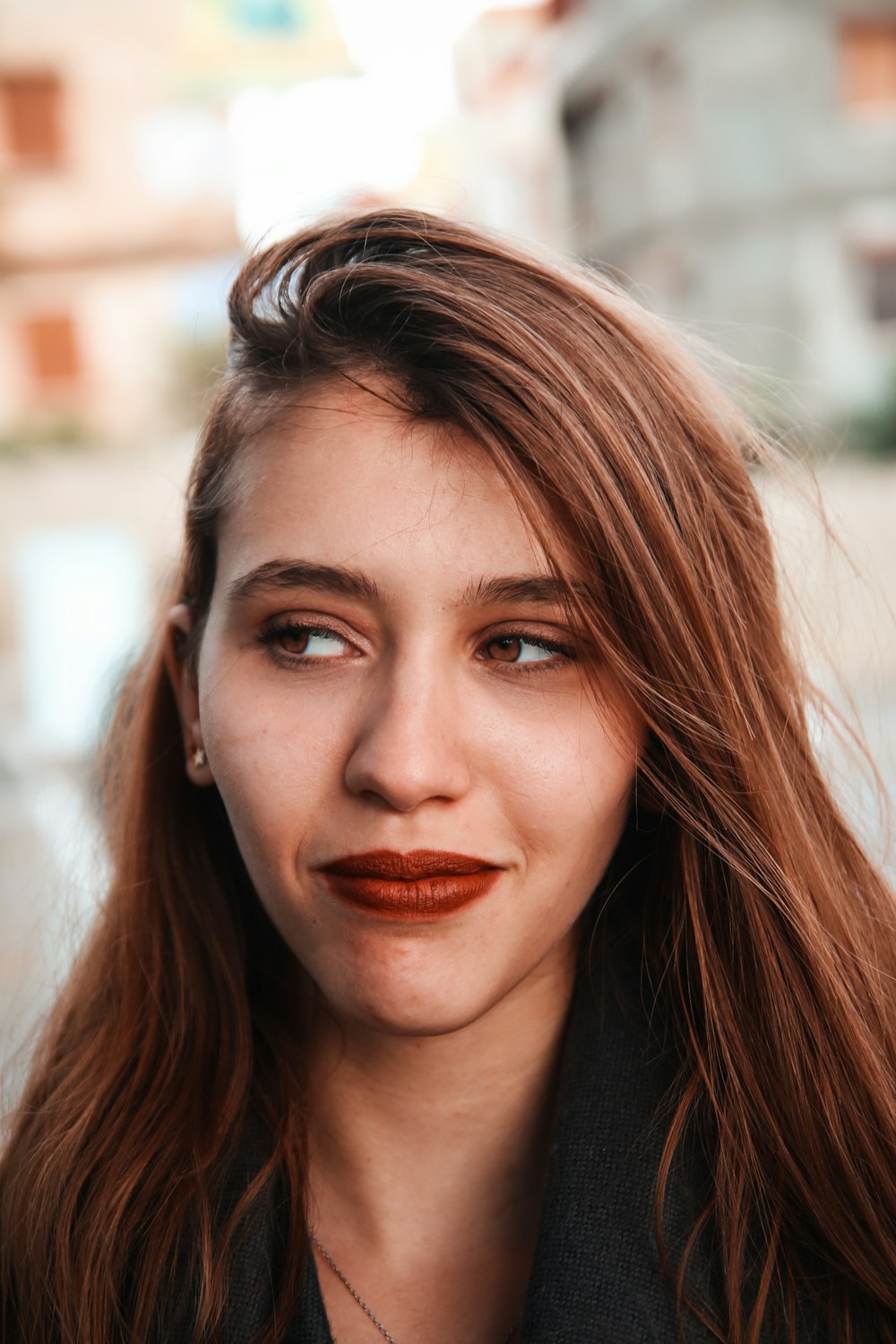 portrait photography of woman wearing red lipstick
