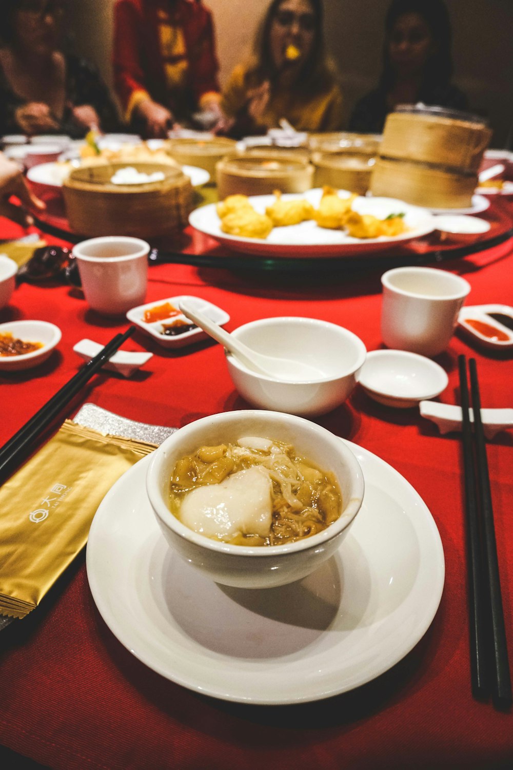 round white ceramic bowl placed near chopstick on tabletop