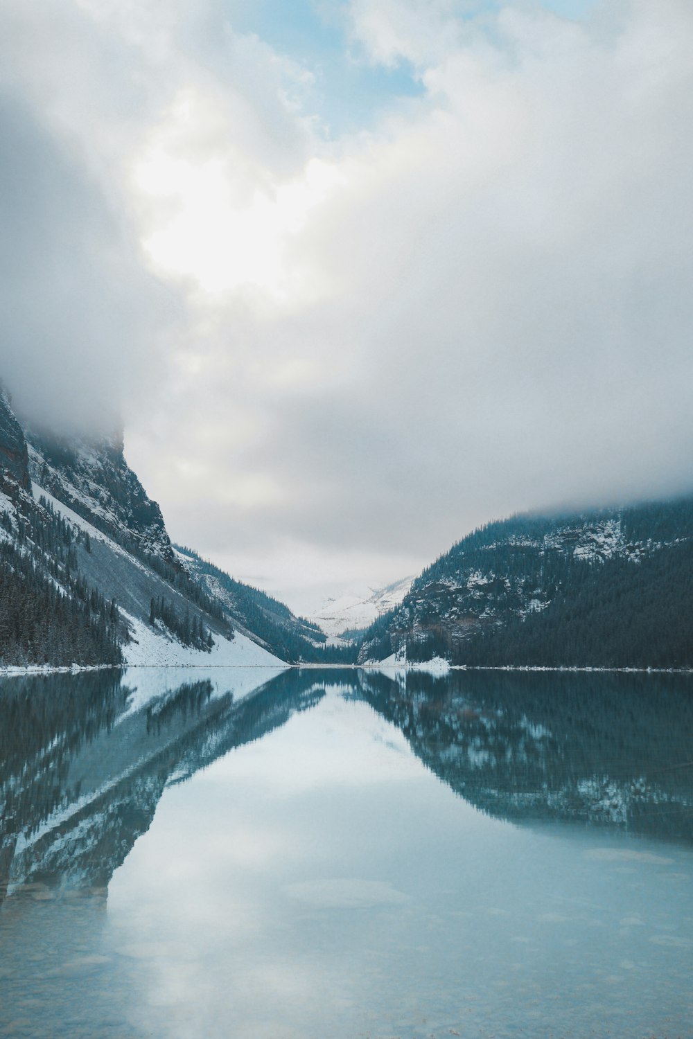 body of water beside mountain