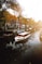 white boat on body of water near buildings during daytime