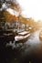 white boat on body of water near buildings during daytime