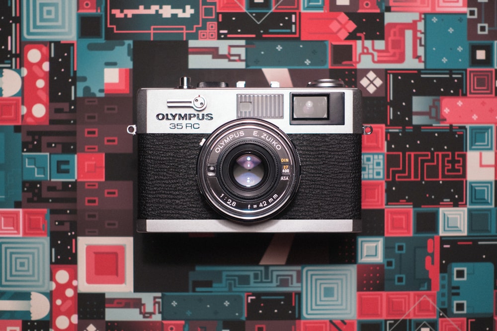 black and grey Olympus SLR camera