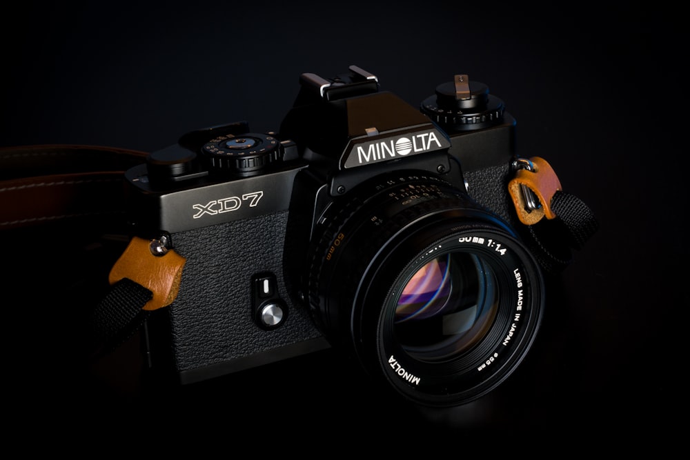 Minolta XD7 camera on black background