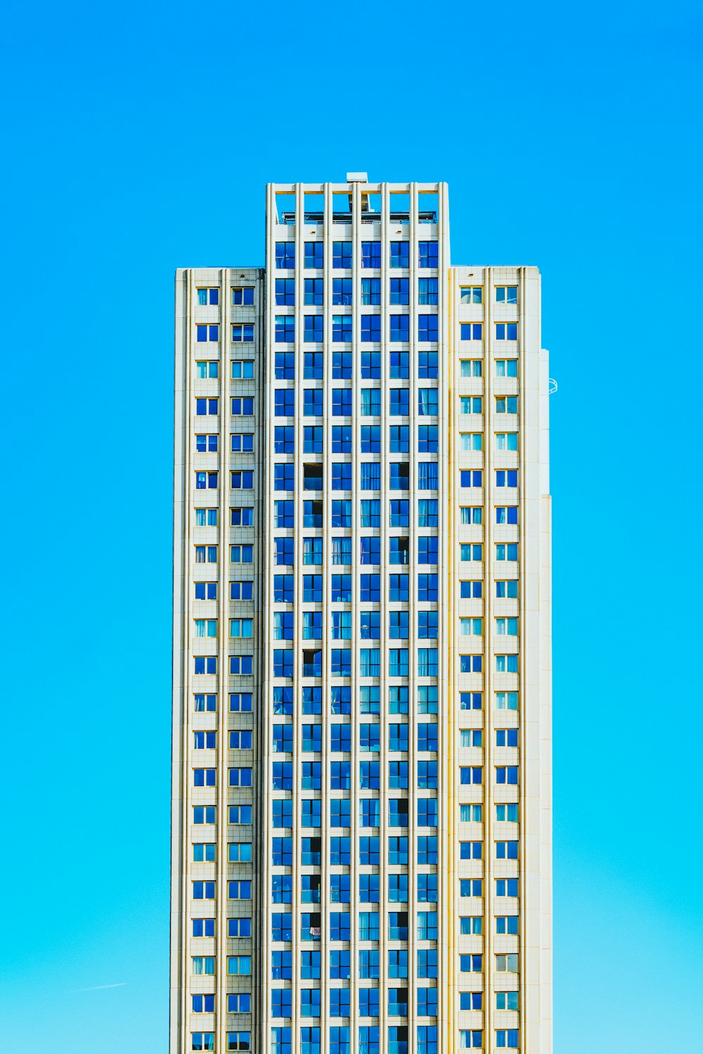 blue and beige high-rise buildings