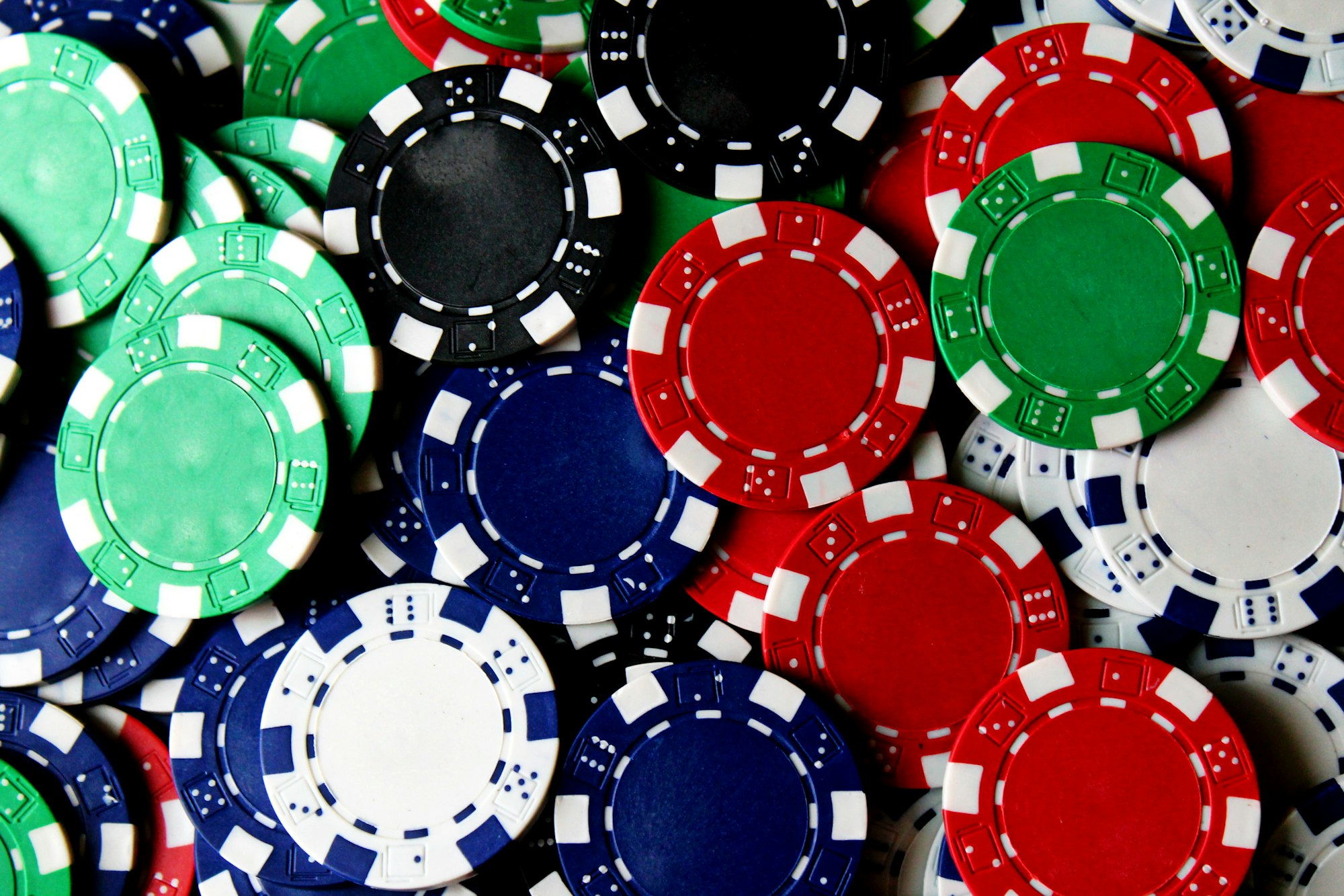 A collection of poker chips in various colors.