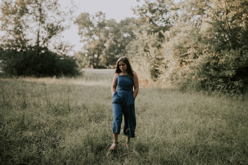 woman standing on grass field