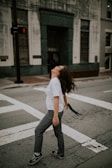 woman standing on road's pedestrian lane