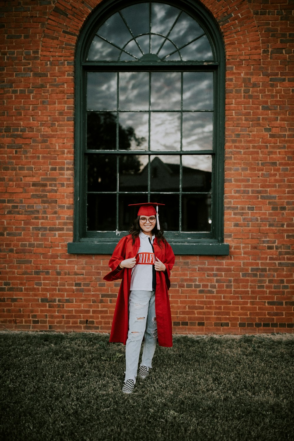 woman wearing academic dress and hat