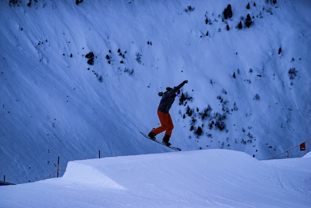 person riding on snowboard