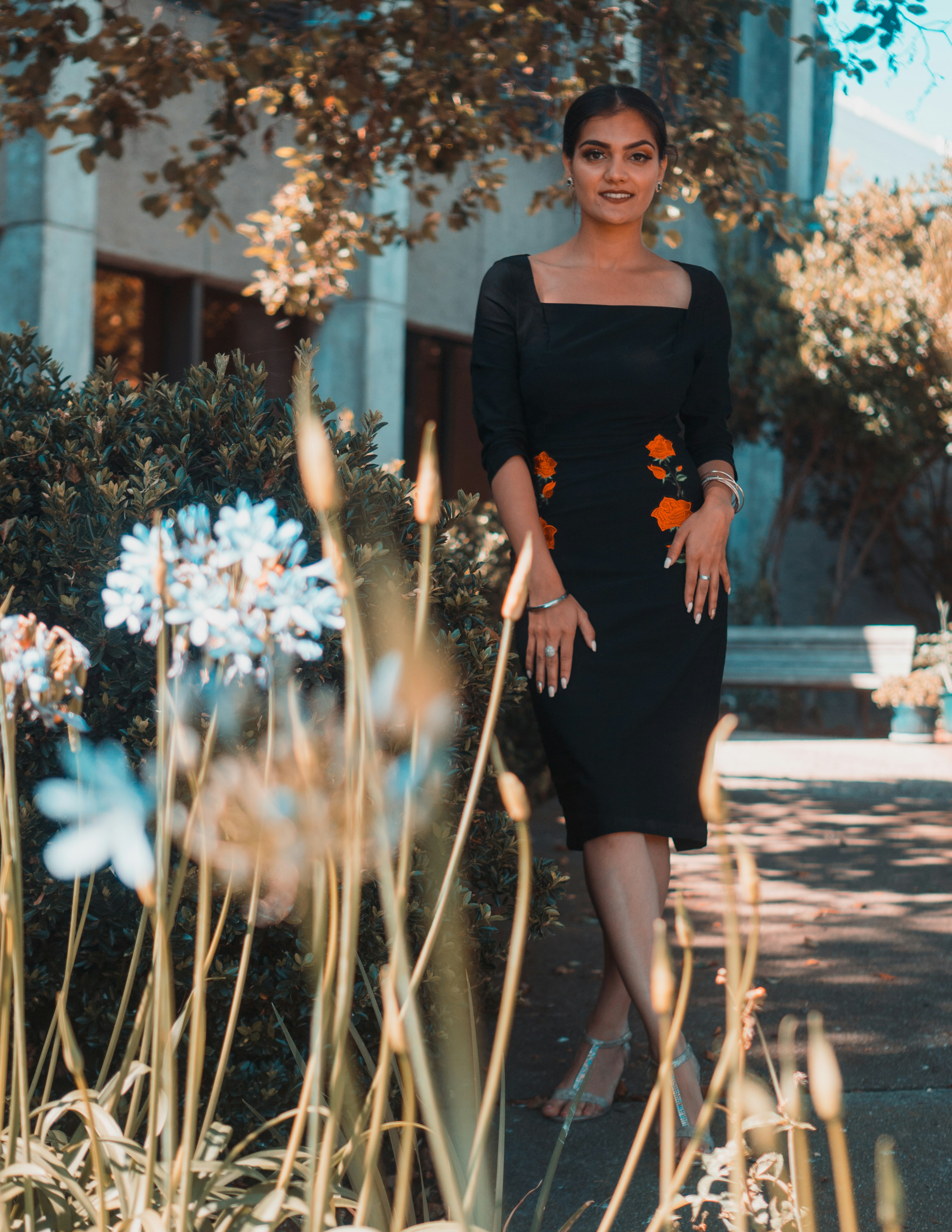 woman standing ear plant