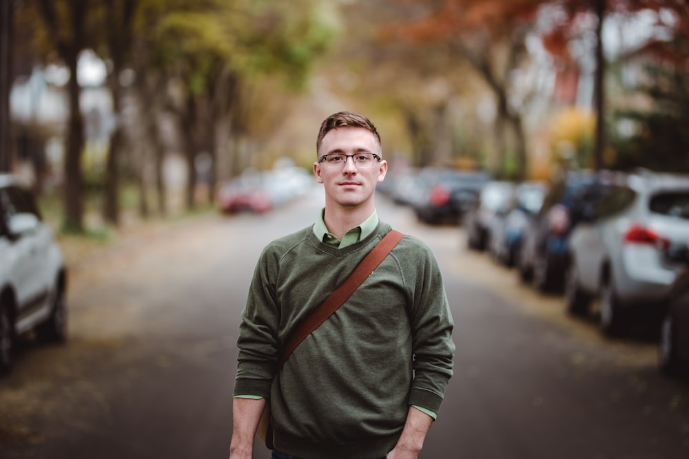 man standing on road