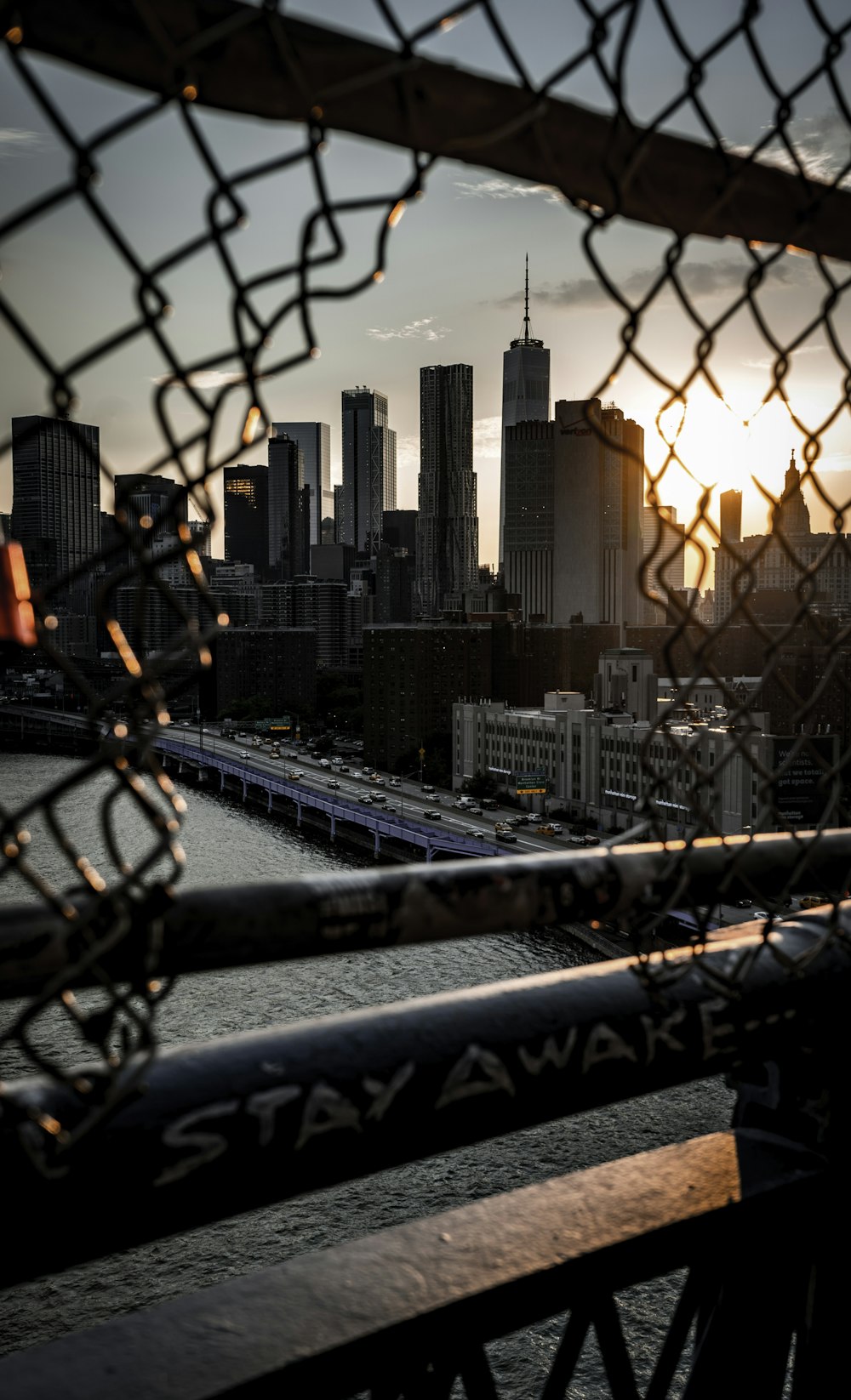 chain link fence overlooking high rise building