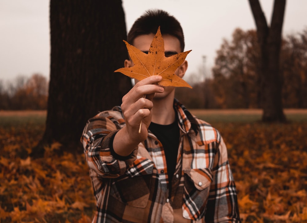 man holding maple leaf