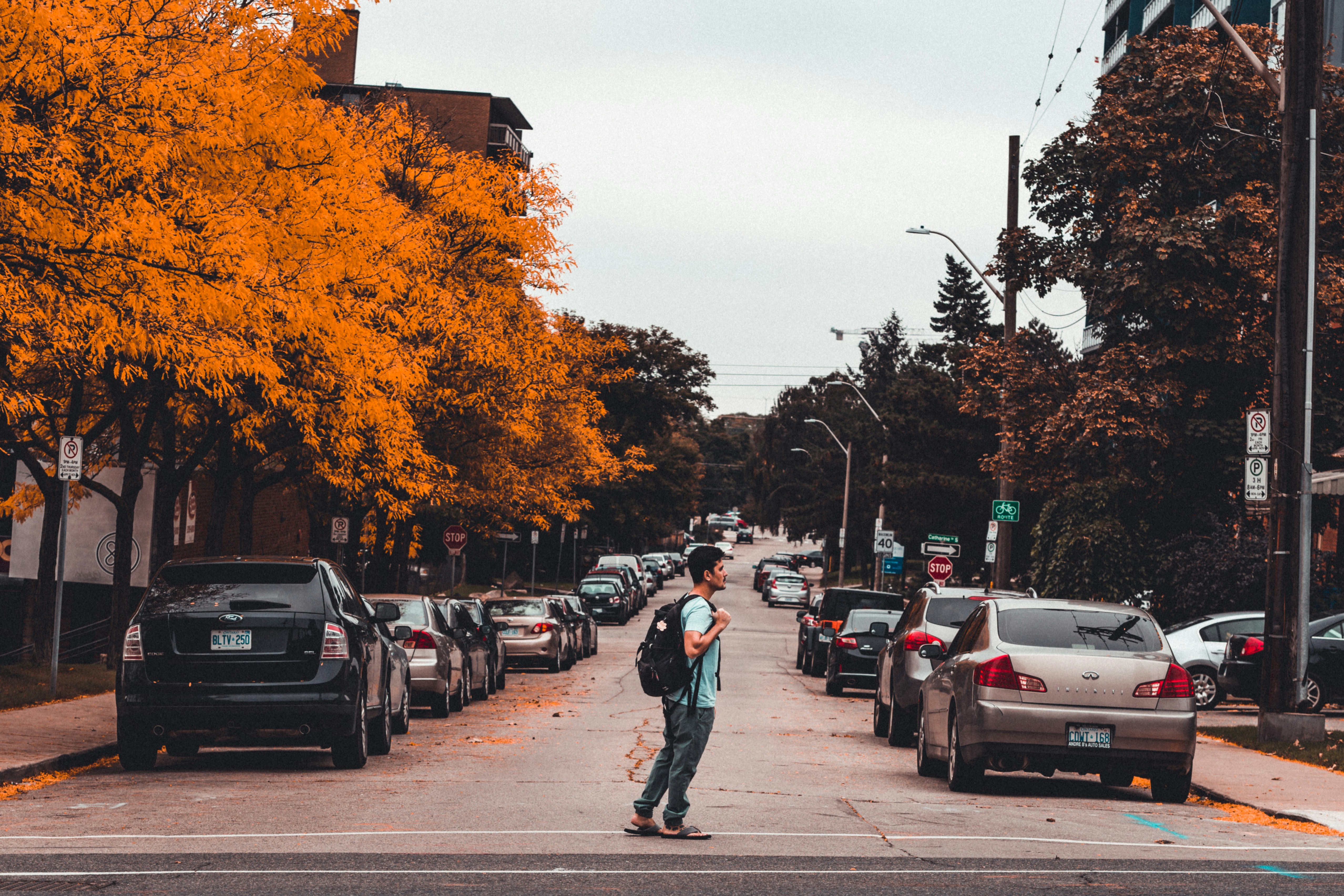 Image of a man walking instead of driving because his auto A/C needs a trusted mechanic to fix it