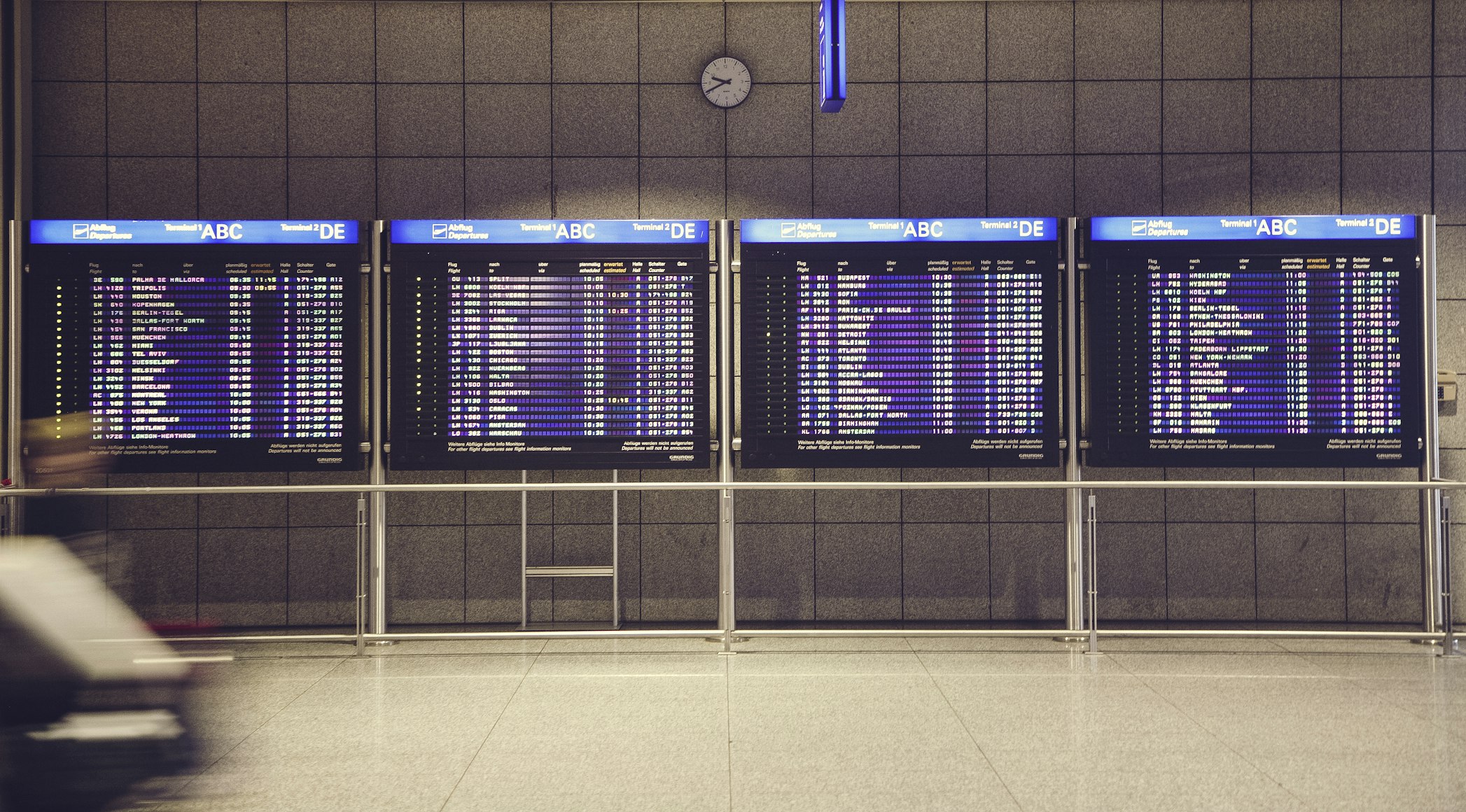 Arrival and departure boards at an airport.