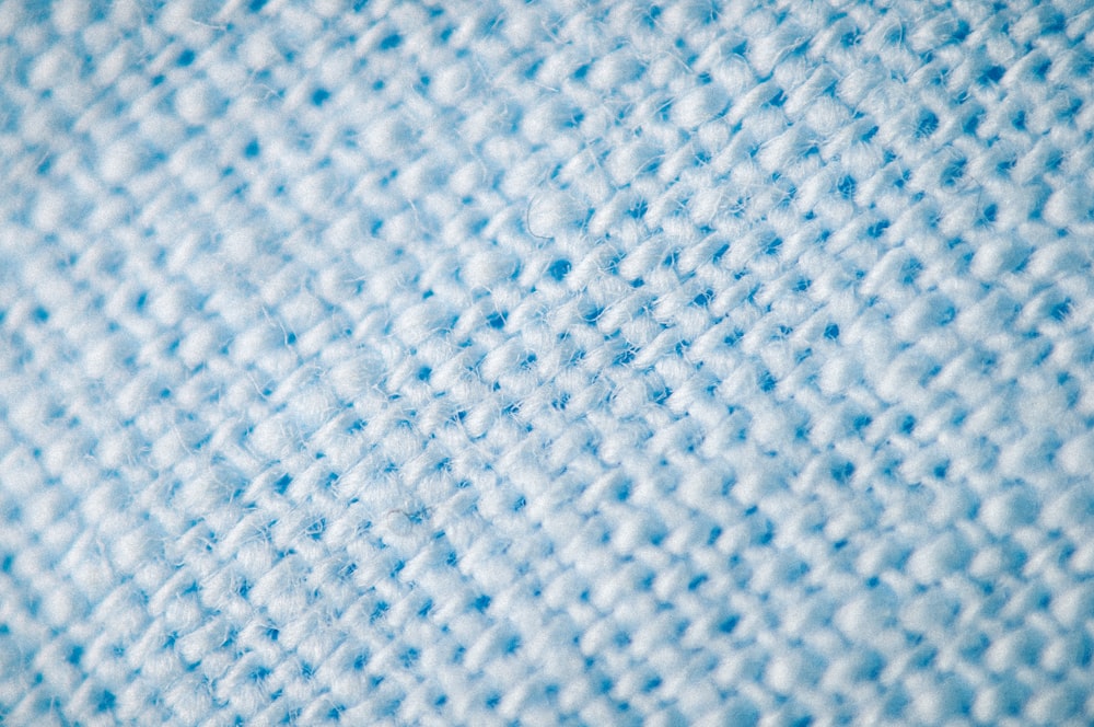 a close up view of a blue blanket