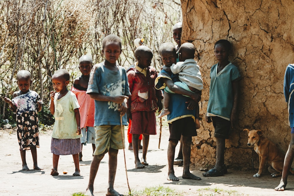 children standing near trees