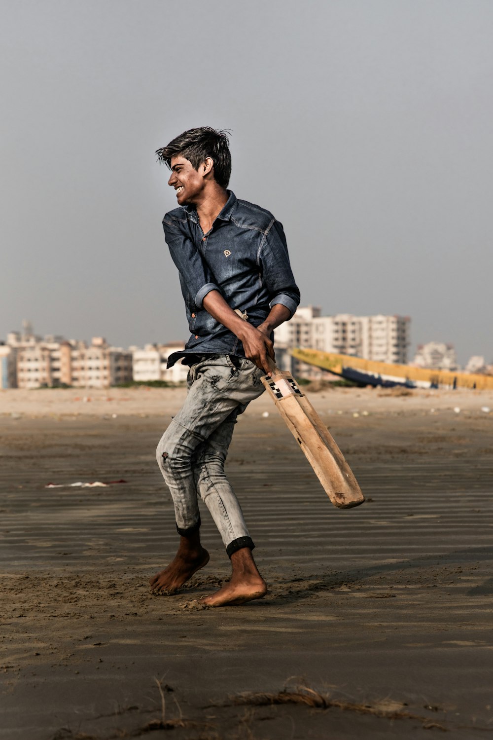 man holding cricket bat