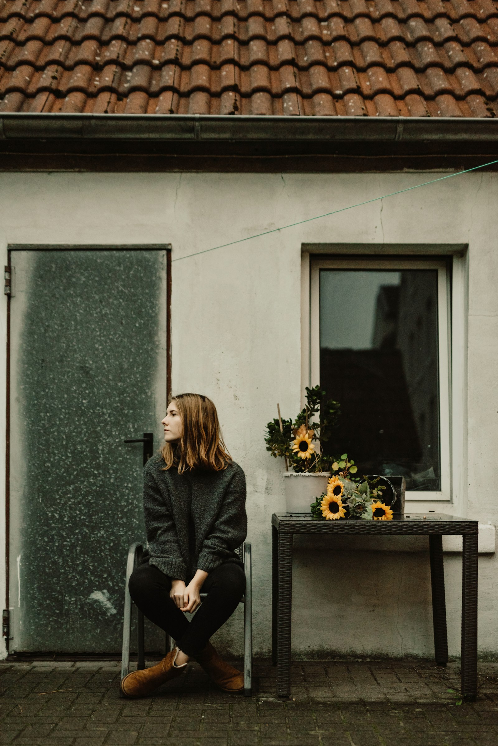 Nikon D750 + Sigma 50mm F1.4 DG HSM Art sample photo. Woman sitting beside door photography