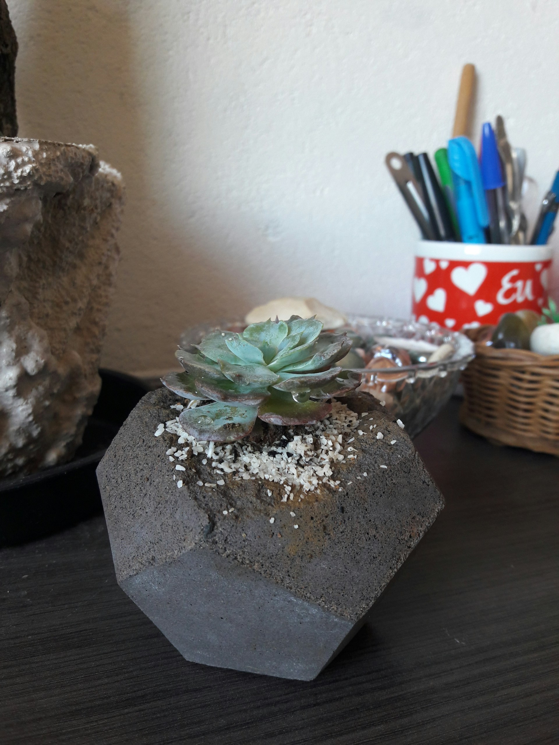 person wearing grey knit sweater