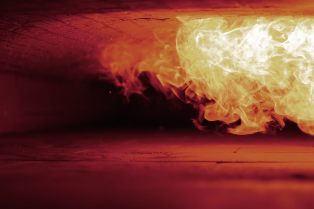 a close up of a fire with a red background