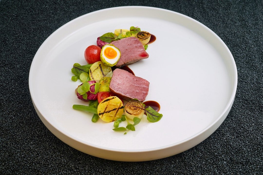 cooked food and vegetables on white plate,