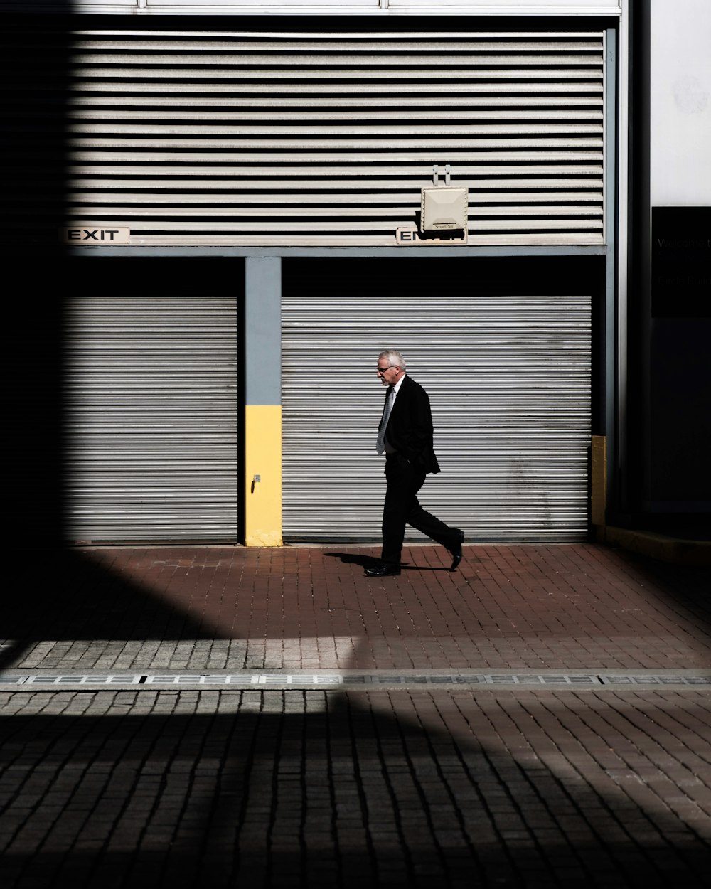 man walking on road