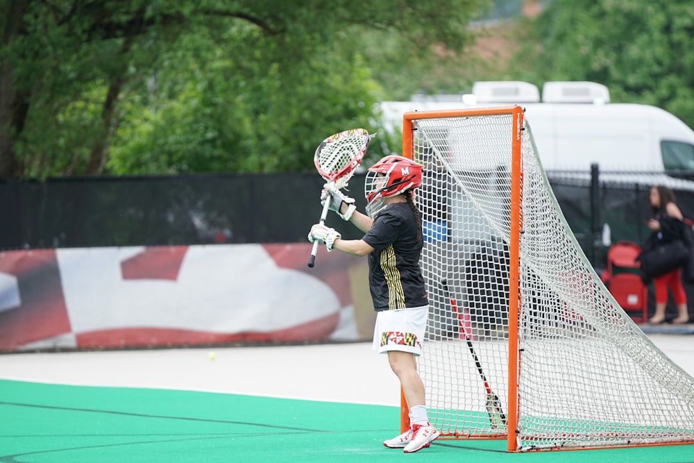 Persona jugando al palo de lacrosse