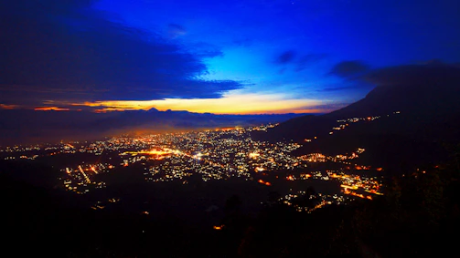 Stunning cinematic frame of a city skyline at dusk with vibrant blue and orange lighting