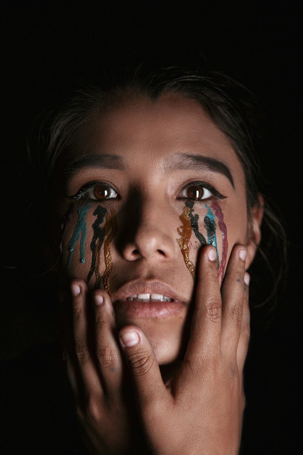 woman with tearing eyes paint