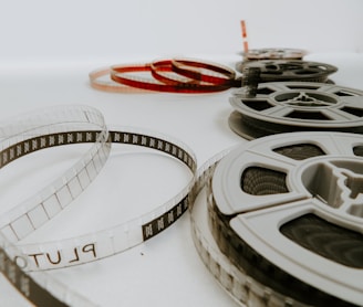 four reel films lying on white table