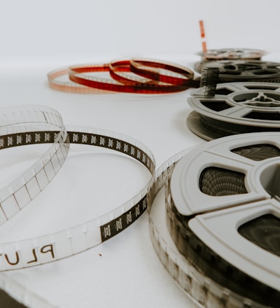 four reel films lying on white table