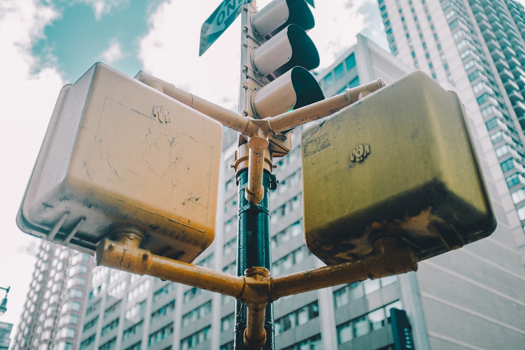 white and yellow traffic light near concrete buildings