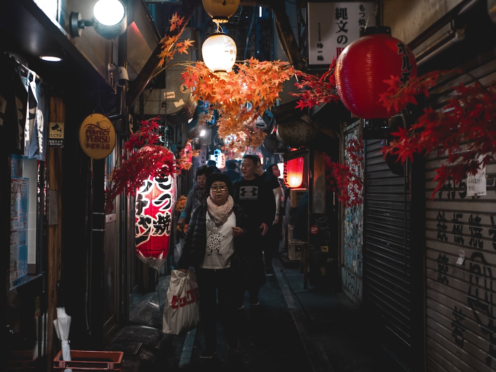 people walking between buildings