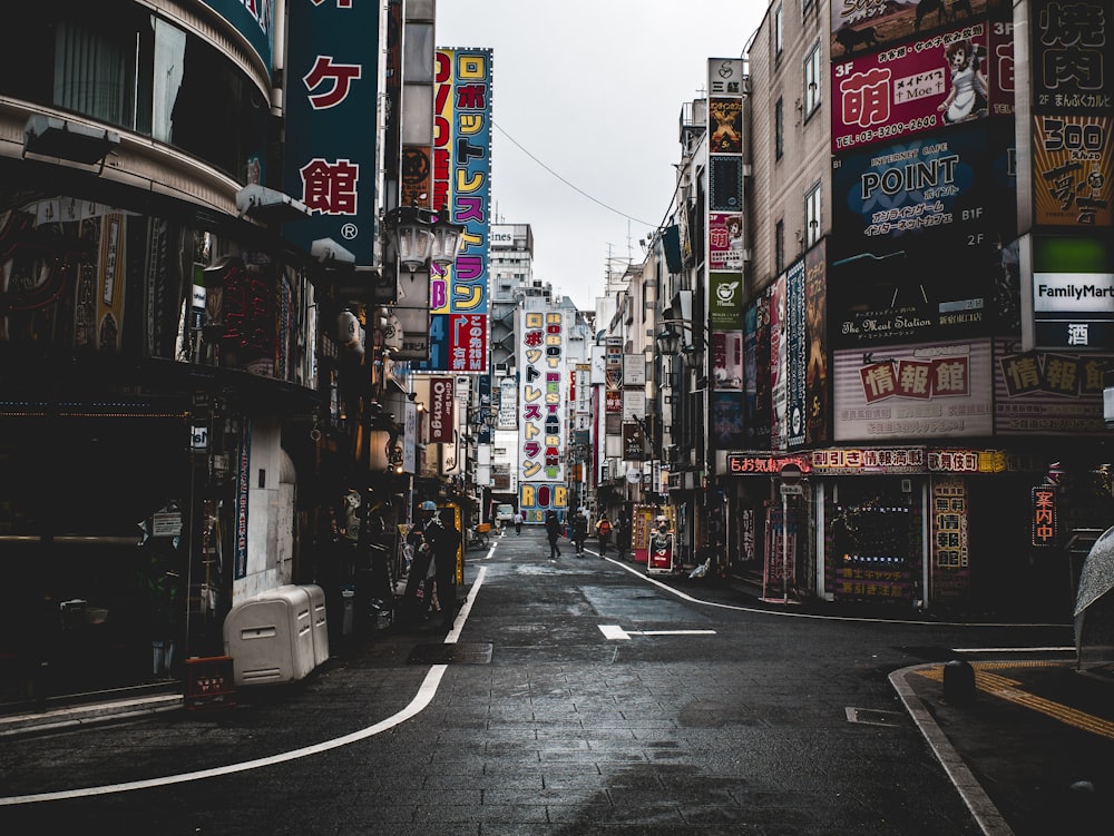 people on street surrounded by buildings during daytime