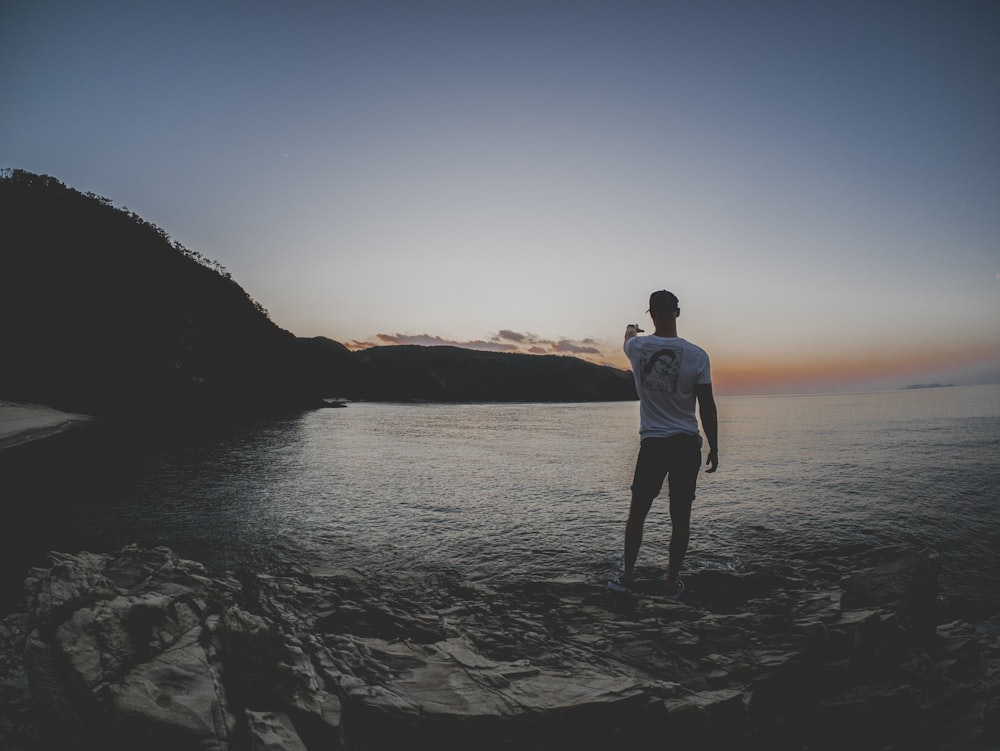 man standing on body of water