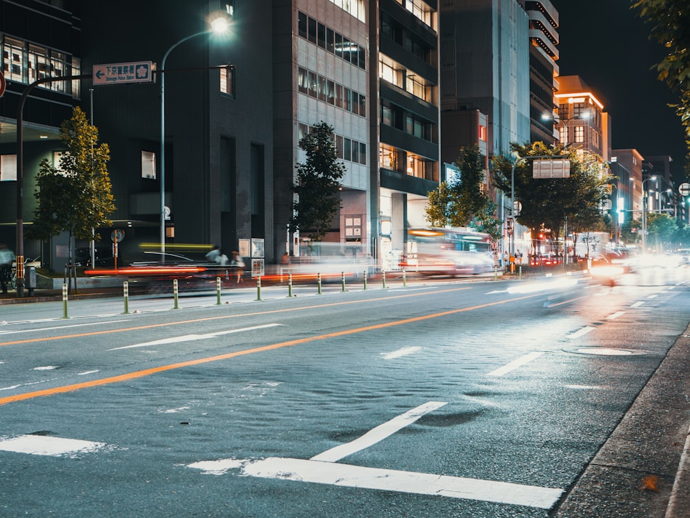 time-lapse photo of traffic lights during nigihttime