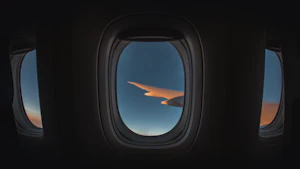 Commercial jet wing against the sky in flight