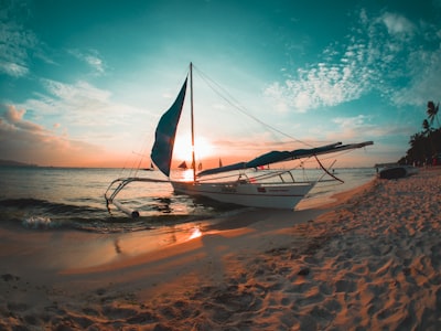 white boat docked on seashore voyage zoom background