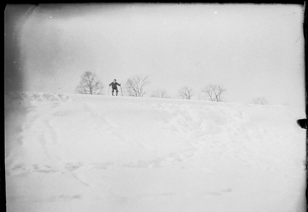 person walking on snow covered ground