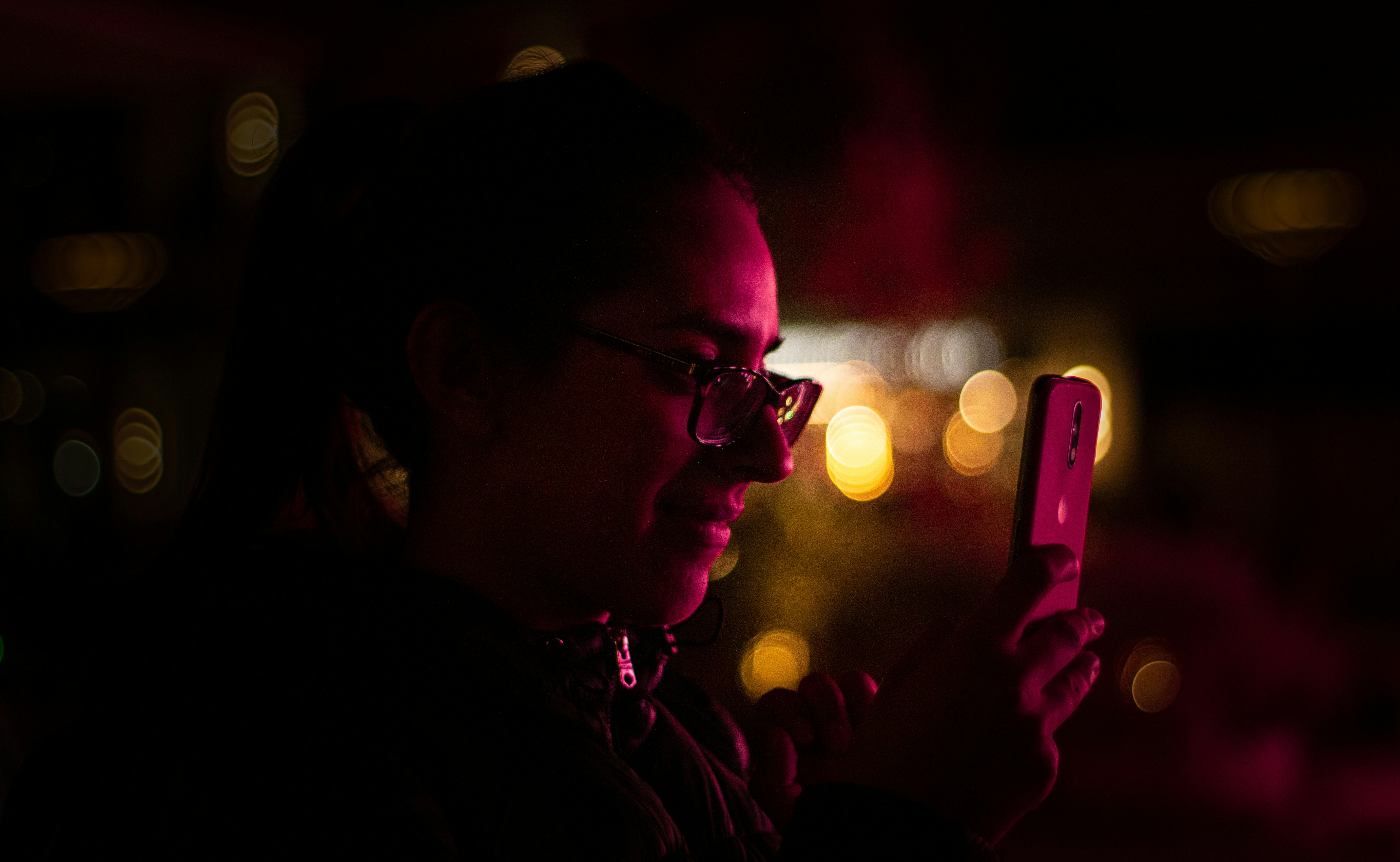 woman using silver iPhone